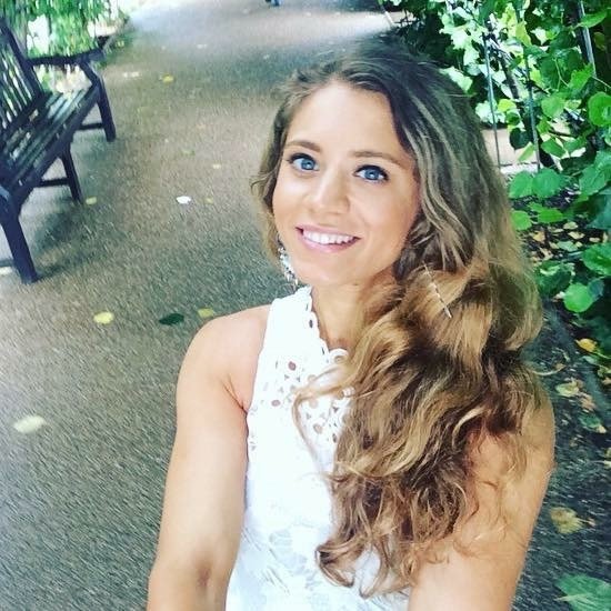 Sabrina outdoors, smiling